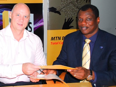 L-R): Brett Goshen, former CEO, MTN Nigeria and Austin Okere, Group CEO, Computer Warehouse Group, at the Sign Off ceremony between CWG and MTN held in Lagos.